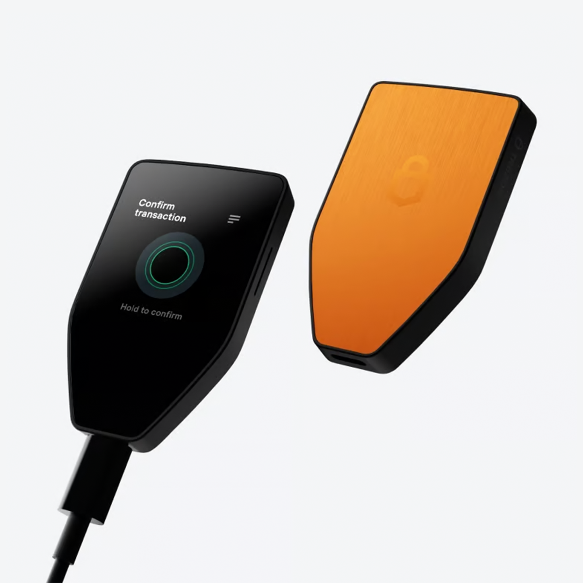Trezor Safe 5 bitcoin-only hardware wallet shown in black with a gold lock icon on the front and a brushed orange-brown back, on a white background.